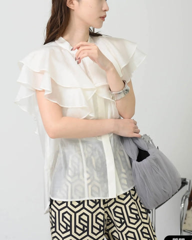 Herencia<br>Frilled sheer blouse