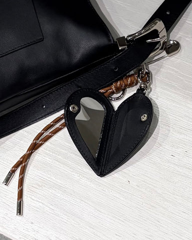 Story．<br> LEATHER ROUND HANDBAG
